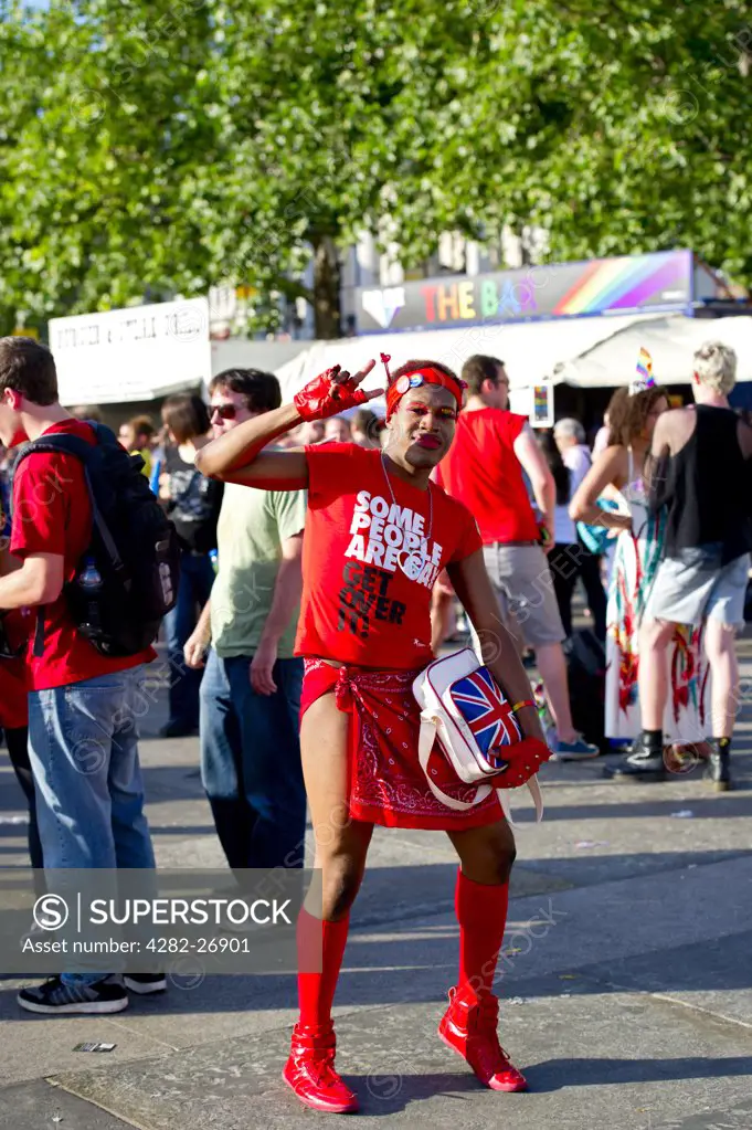 England, London, Trafalgar Square. A young man celebrating his sexuality at Gay Pride 2010.