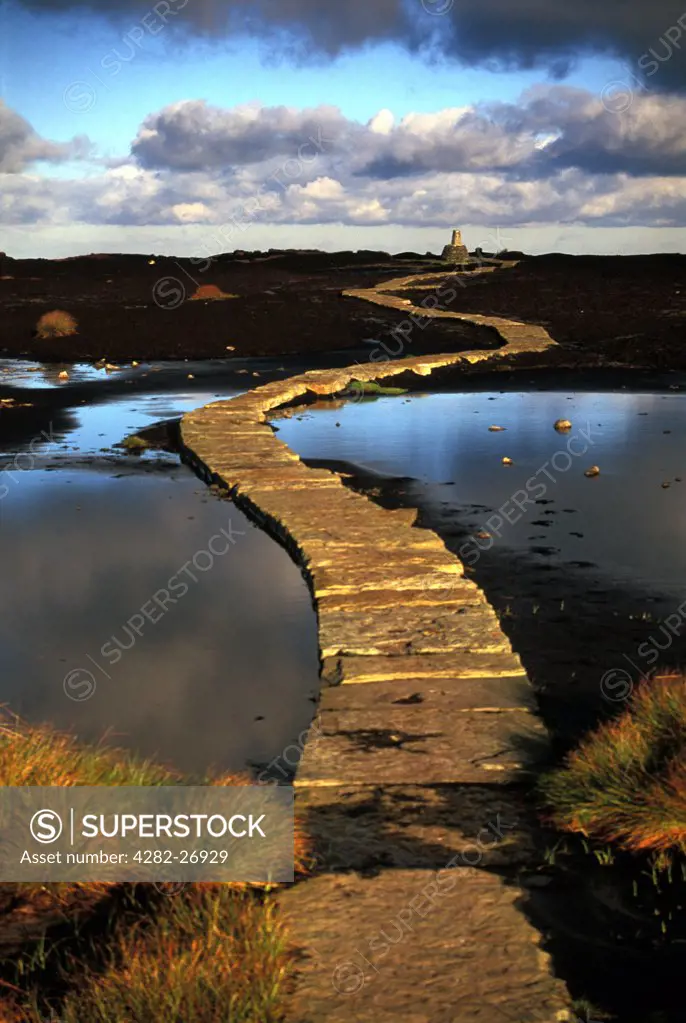 England, Derbyshire, Black Hill. The Pennine Way leading to trig point at Soldier's Lump summit on Black Hill.