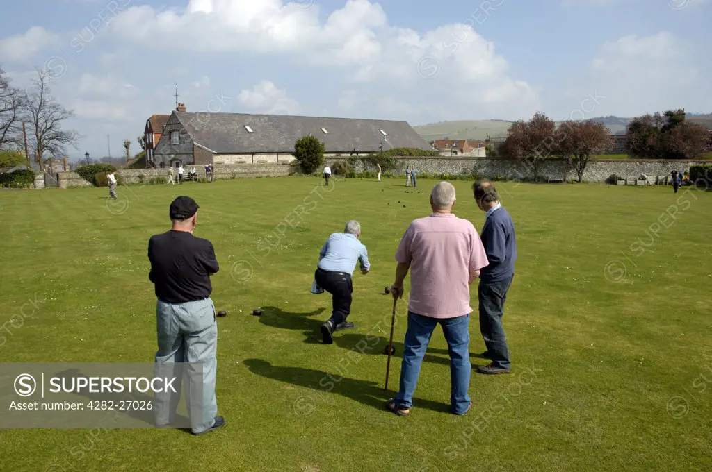 England, East Sussex, Lewes. A group of men play bowls on a bowling green in Lewes.
