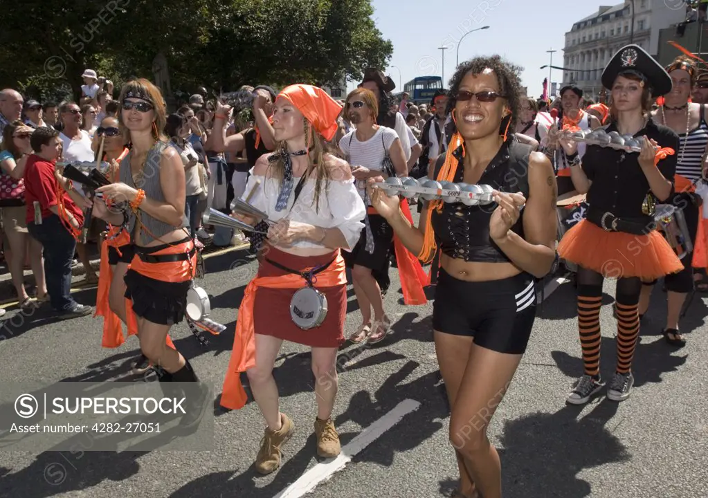 England, East Sussex, Brighton. Women taking part in the annual Gay Pride Parade in Brighton.