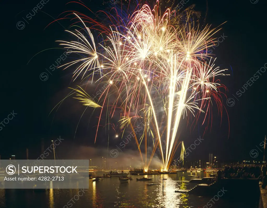 England, Isle of Wight, Cowes. Firework display to mark the end of Cowes Week.