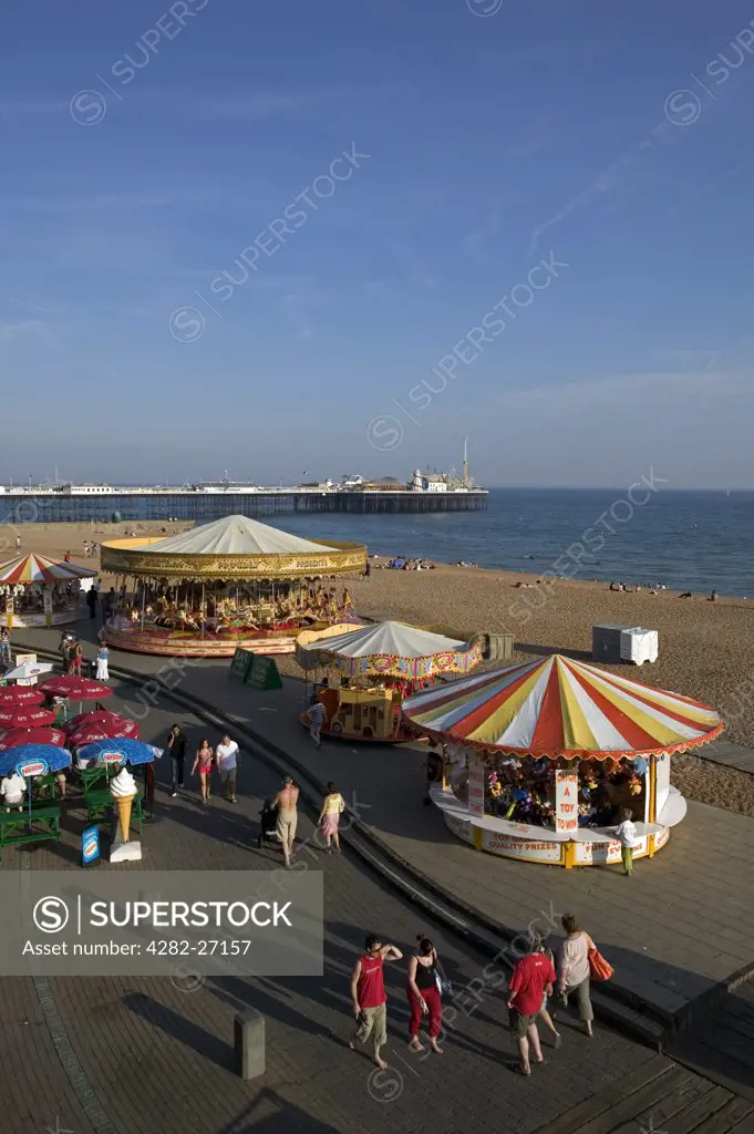 England, East Sussex, Brighton. Brighton Beach Promenade and the Palace Pier. The pier was designed by R St George Moore and finished in 1901.