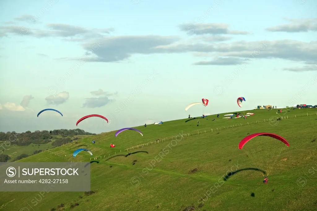 England, West Sussex, Devil's Dyke. People paragliding over the South Downs.