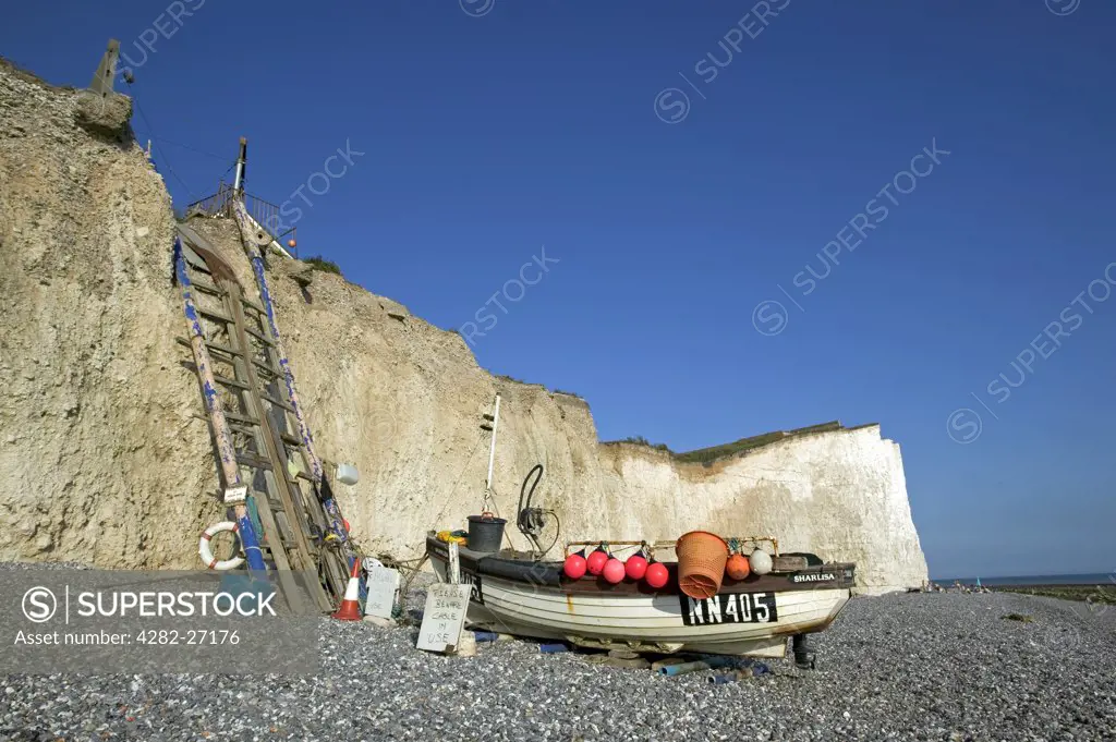England, East Sussex, Birling Gap. Fishing boat on beach at Birling Gap. Birling Gap is a coastal hamlet situated on the Seven Sisters not far from Beachy Head.