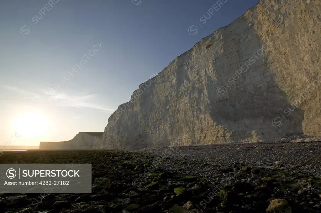 England, East Sussex, Birling Gap. Sunset at Birling Gap. Birling Gap is a coastal hamlet situated on the Seven Sisters not far from Beachy Head.