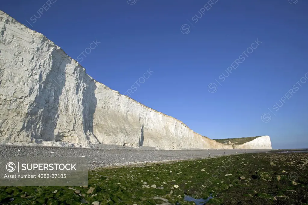 England, East Sussex, Birling Gap. Walking at Birling Gap. Birling Gap is a coastal hamlet situated on the Seven Sisters not far from Beachy Head.