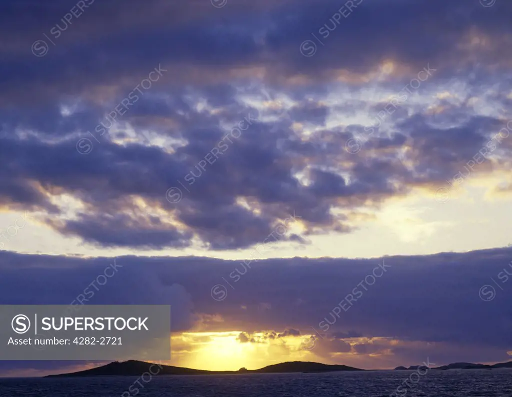 England, Isles of Scilly, Tresco. Scillonian sunset looking towards Tresco from St. Mary's.