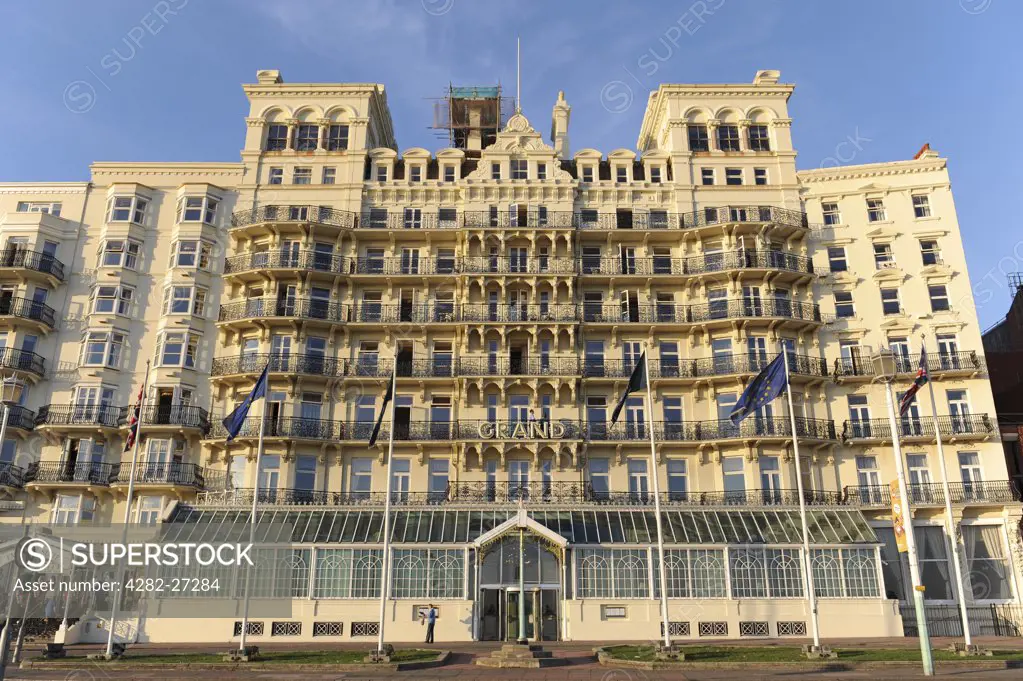 England, East Sussex, Brighton. An exterior view of the Grand Hotel on the seafront in Brighton.