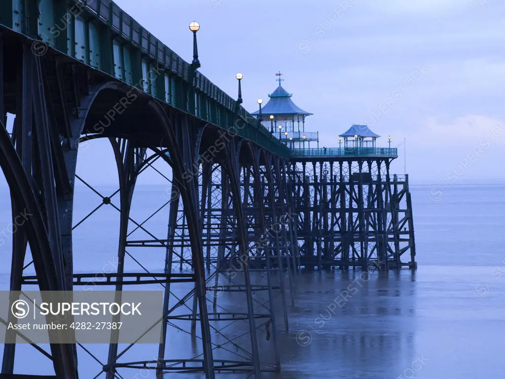 England, Somerset, Clevedon. View towards the pavilion on the pier-head of Clevedon Pier at twilight.