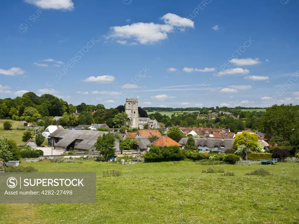 England, Wiltshire, Aldbourne. View over the village of Aldbourne dominated by the church of Saint Michael, a medieval and a Grade I listed building dating back to 1200.