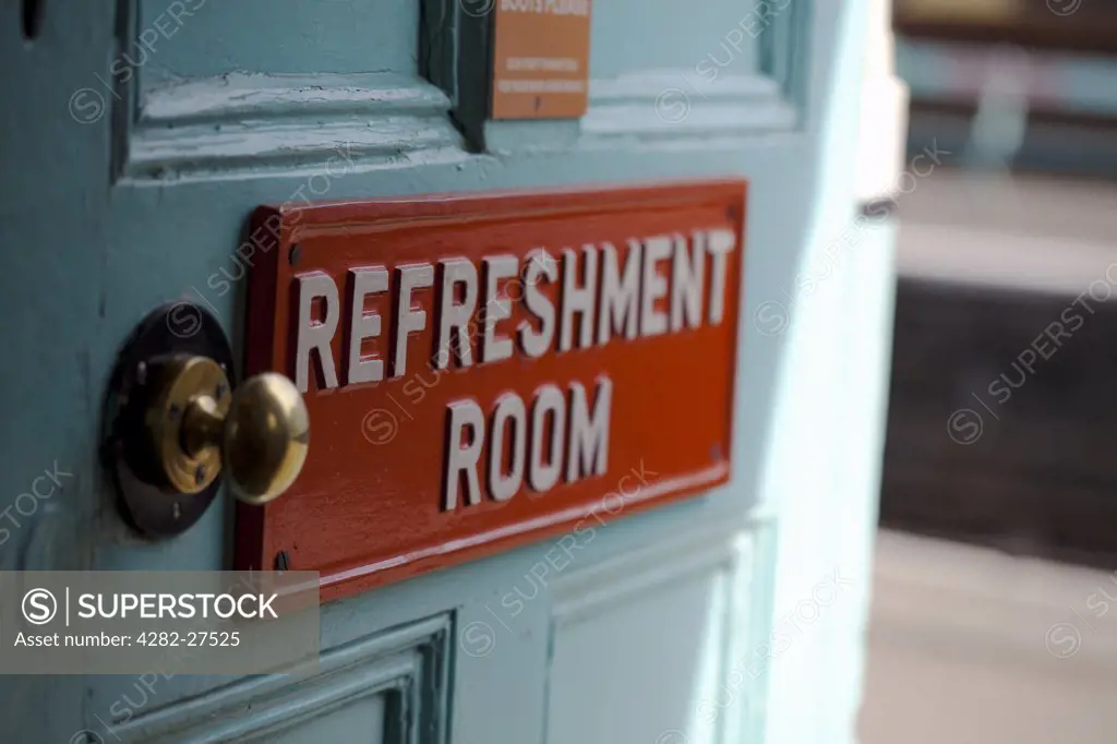 England, North Yorkshire, Whitby. A sign reading 'Refreshment Room' on a door leading off a train station platform.