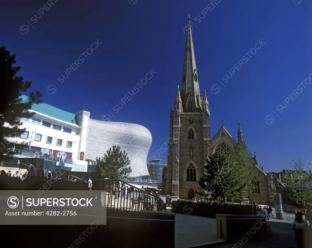 England, West Midlands, Birmingham. View of Selfridges store in the Bullring and St. Martin's Church.