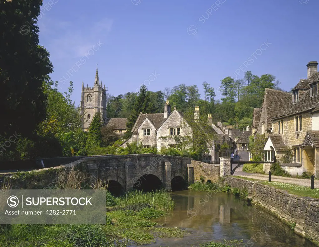 England, Wiltshire, Castle Combe. A view along the river to Castle Combe.