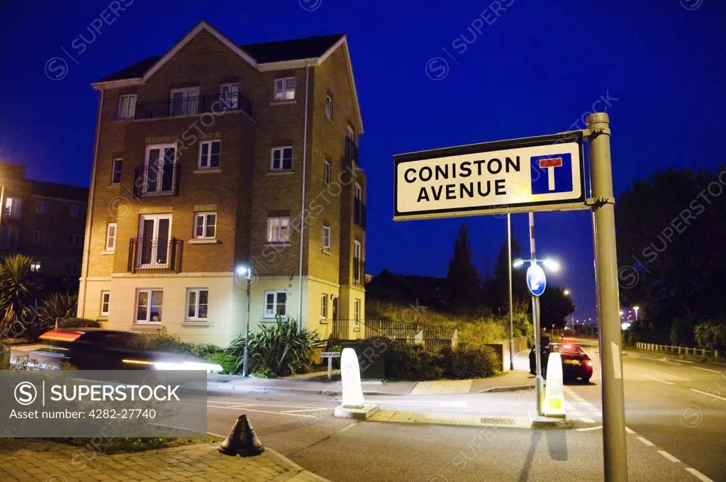 England, Essex, Purfleet. A road sign lit by a street lamp on a newly built housing estate in Purfleet.