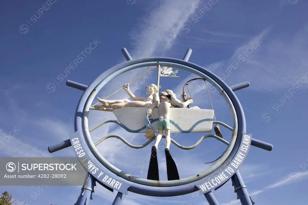 Wales, Vale of Glamorgan, Barry Island. A close up of the ship wheel welcome sign to Barry Island in Glamorgan.