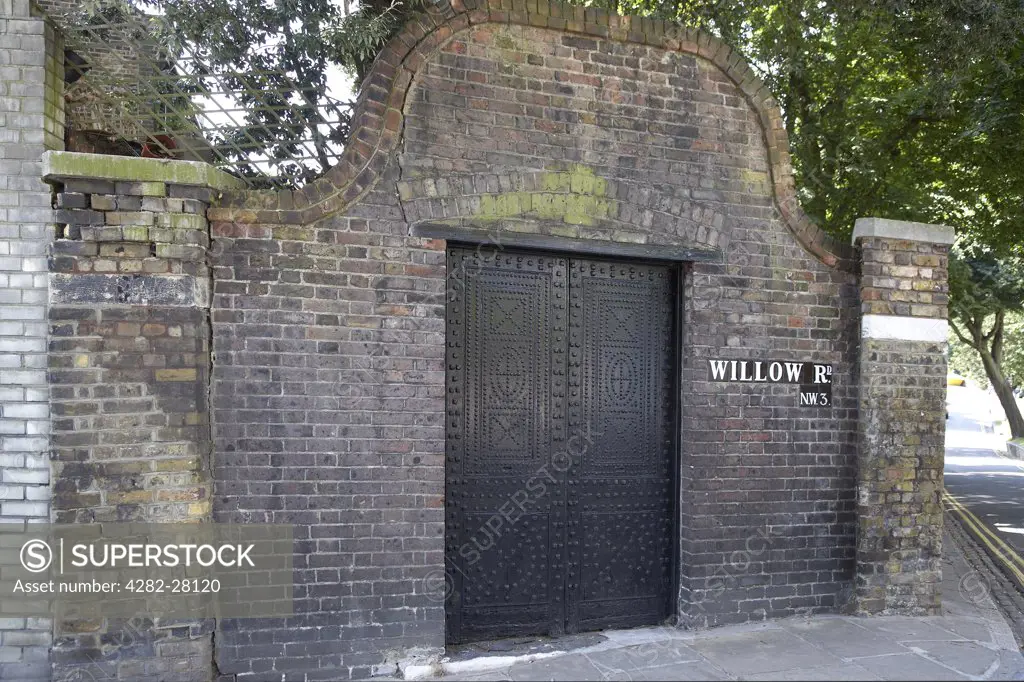 England, London, Hampstead. Exterior view of a large black studded door at Hampstead in London.