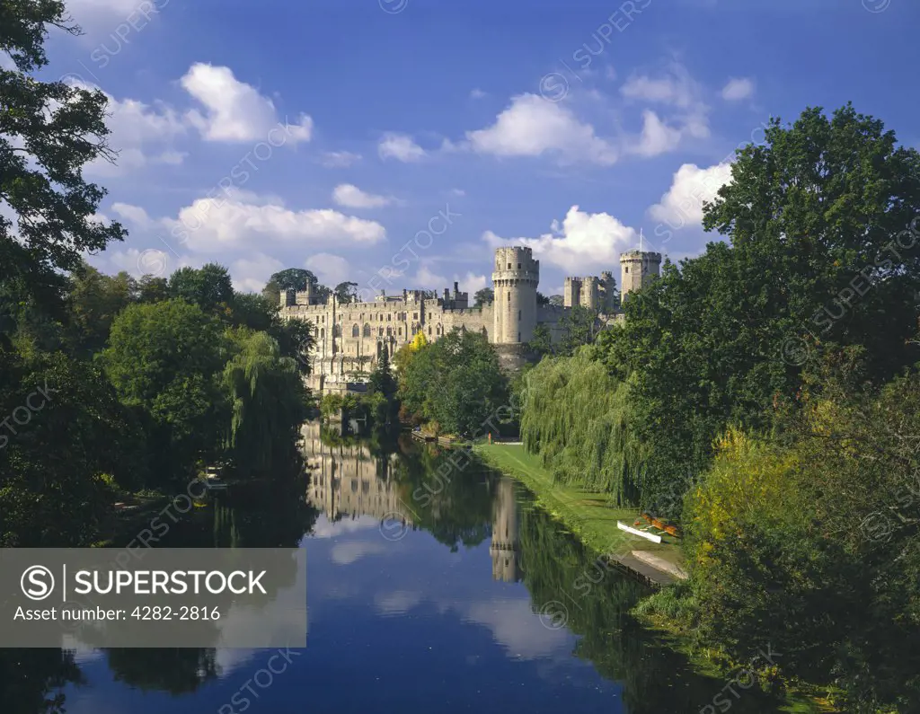 England, Warwickshire, Warwick. Warwick Castle as seen along the River Avon.