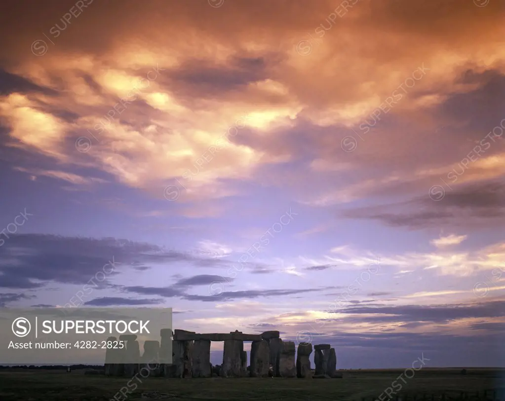 England, Wiltshire, Stonehenge. A dramatic sunset at Stonehenge.