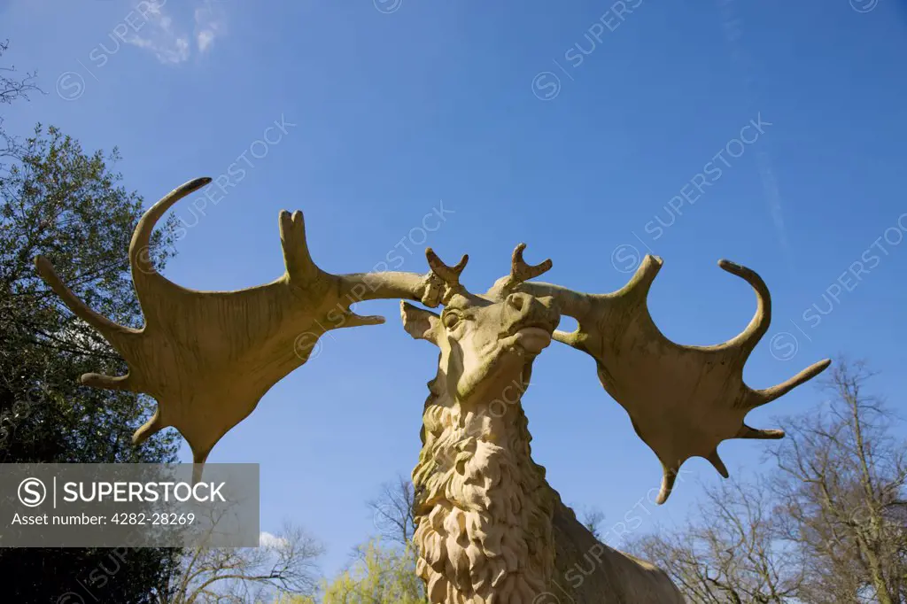 England, London, Crystal Palace. A close up of a statue of a stag in Crystal Palace.