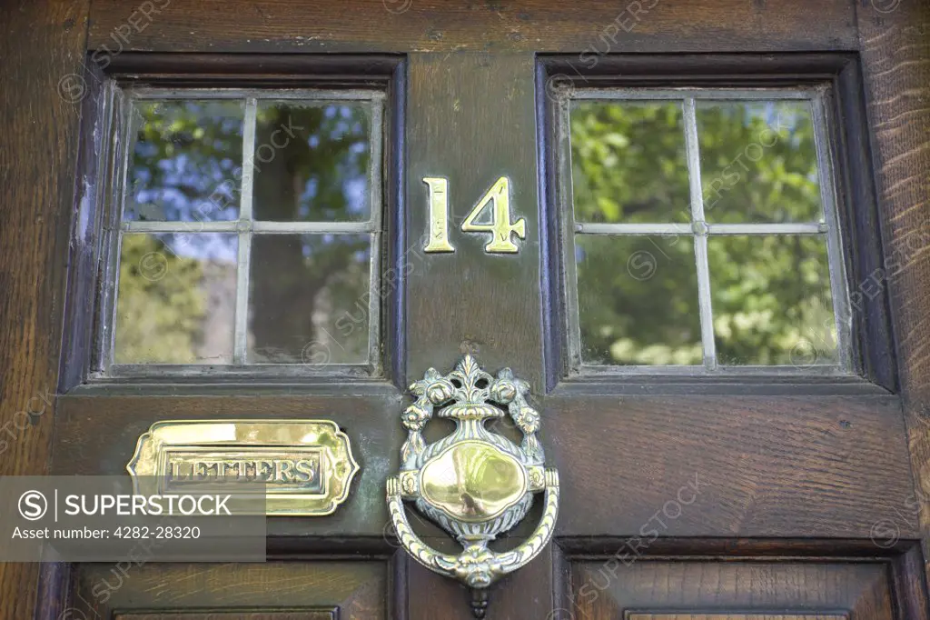 England, Shropshire, Ludlow. A traditional style front door and door furniture.