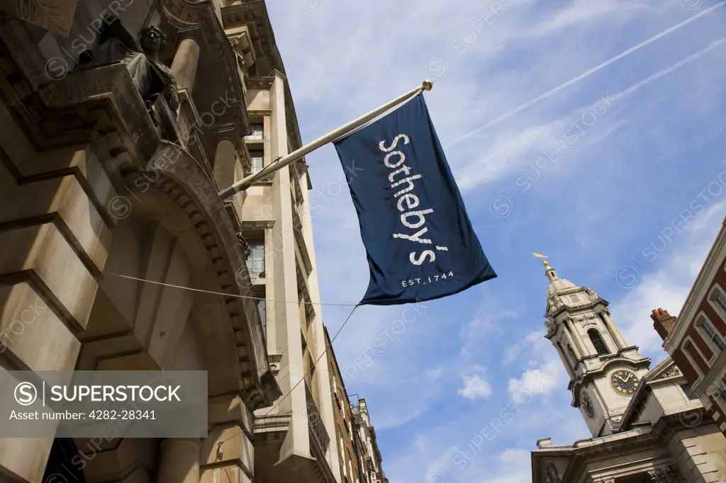 England, London, West End. Flag flying above the entrance to Sotheby's in London.