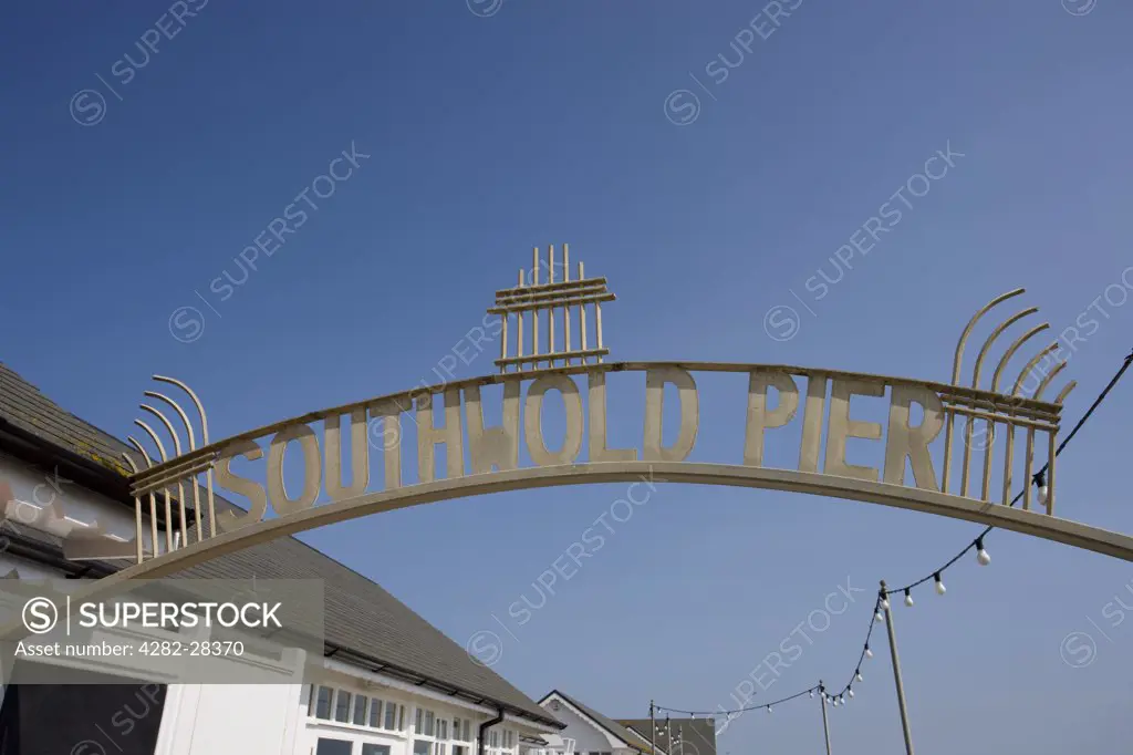 England, Suffolk, Southwold. Southwold Pier sign over the entrance to the pier.
