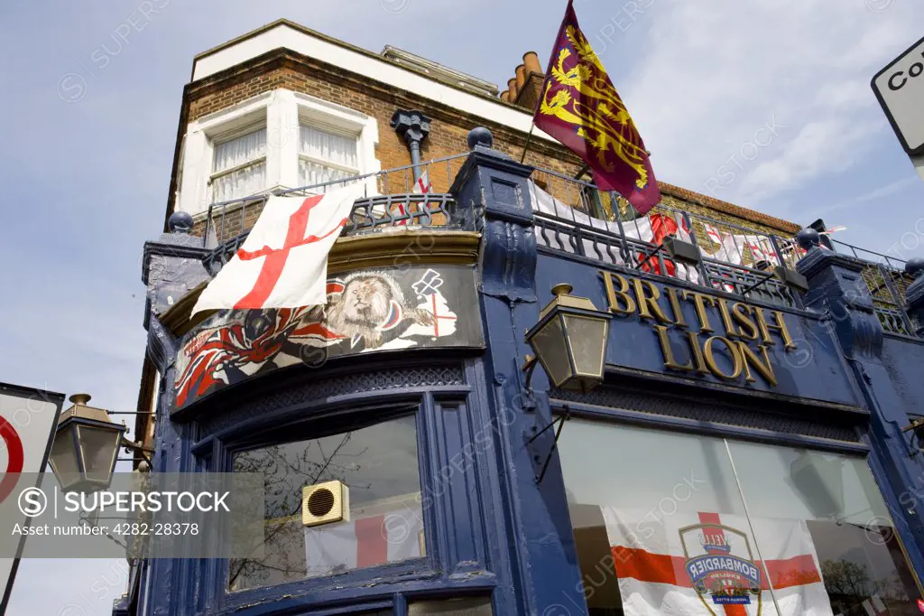 England, London, Hackney. St George flags flying outside the British Lion pub on Hackney Road