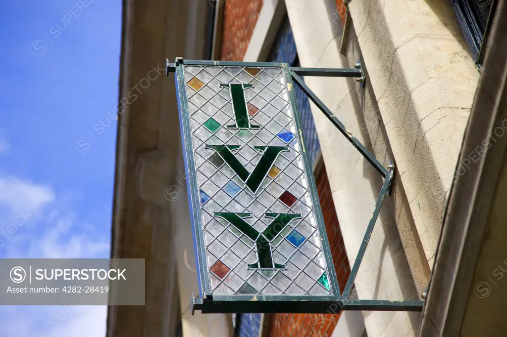 England, London, West Street, West End. The Ivy Sign hanging on the outside of the famous west end restaurant, known for the rich and famous clientele that regularly dine there.