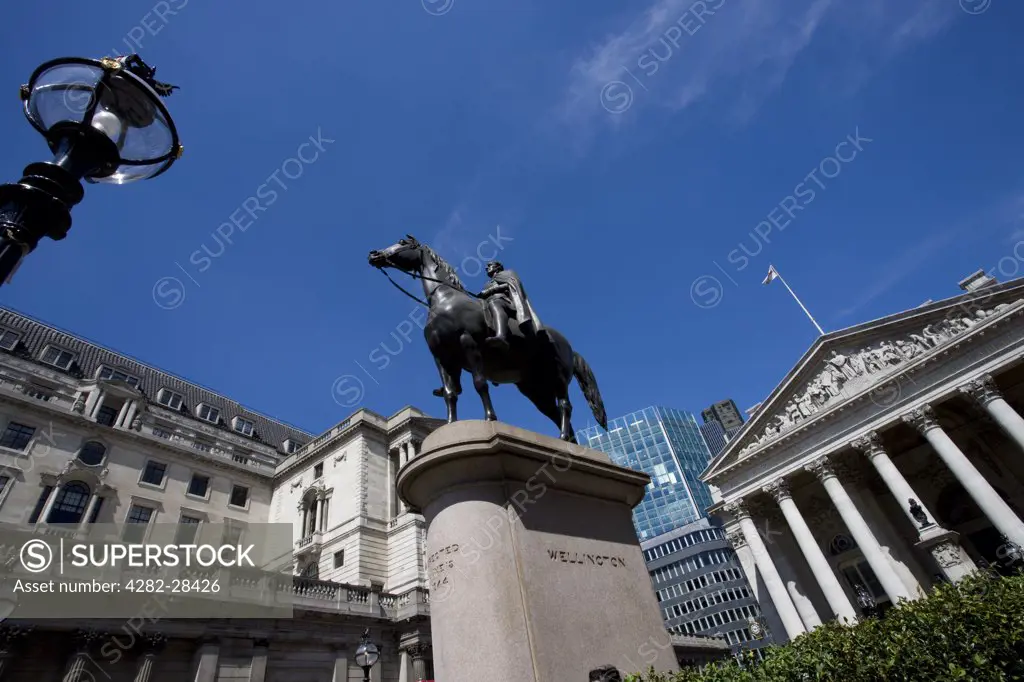 England, London, City of London. A statue of the Duke of Wellington outside the Royal Exchange. The statue is cast from the guns captured from the French in battle.