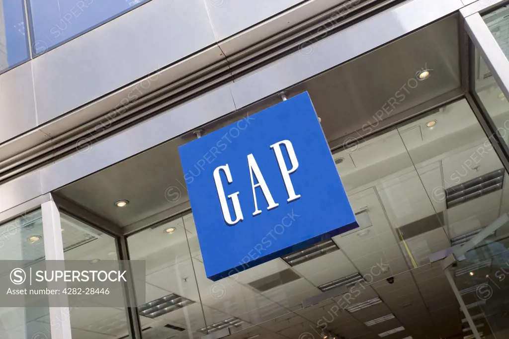 England, London, City of London. A GAP sign hanging outside one of their stores in the City of London.