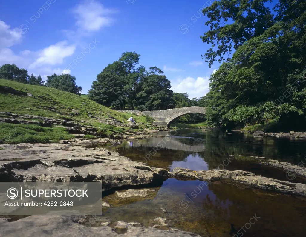 England, North Yorkshire, Stainforth. Stainforth Bridge across the River Ribble.