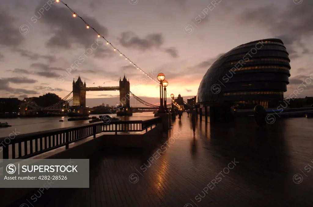 England, London, Tower Bridge. Dawn on the south bank of the River Thames with Tower Bridge and City Hall.
