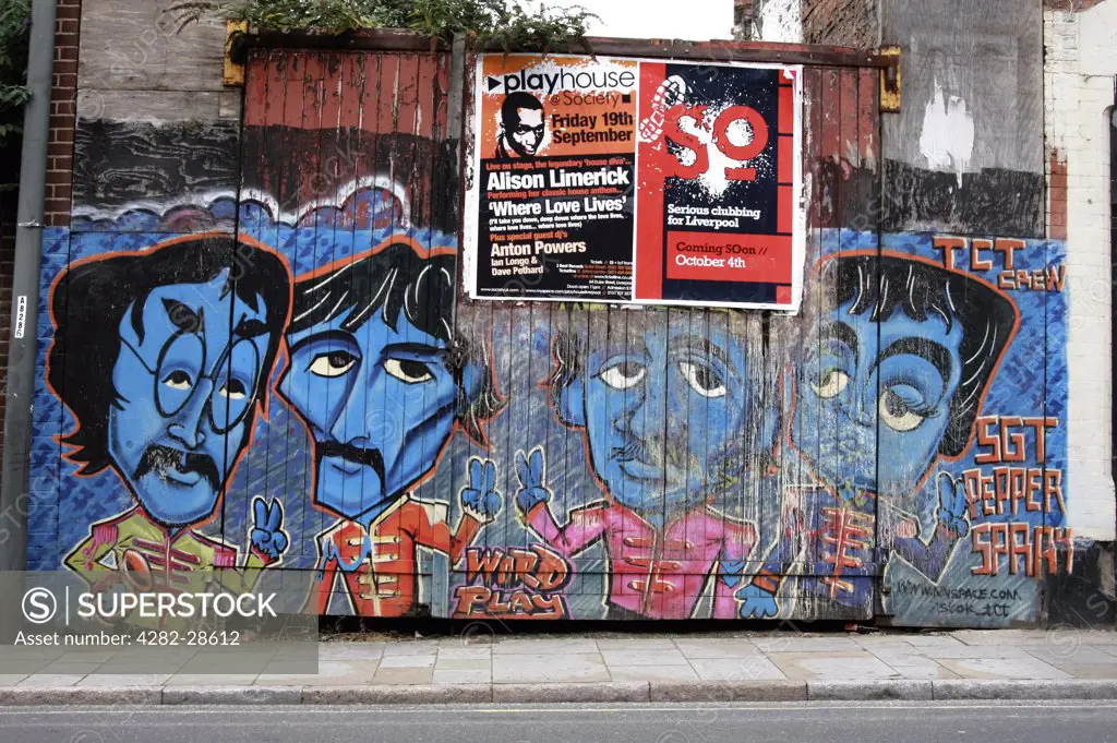 England, Merseyside, Liverpool. Graffiti on a gate in Liverpool featuring The Beatles.