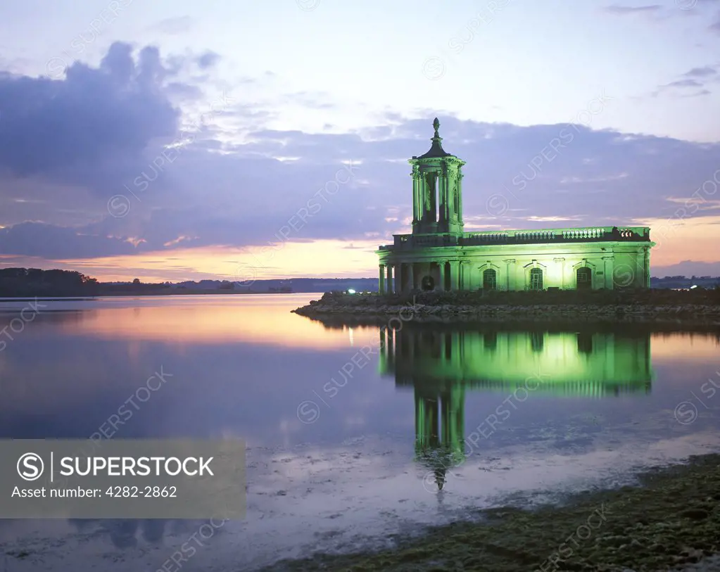 England, Rutland, Empingham. Evening scene with illuminated Normanton Church.