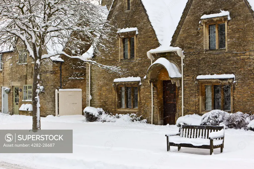England, Gloucestershire, South Cerney. Snow falling in the Cotswold village of South Cerney.