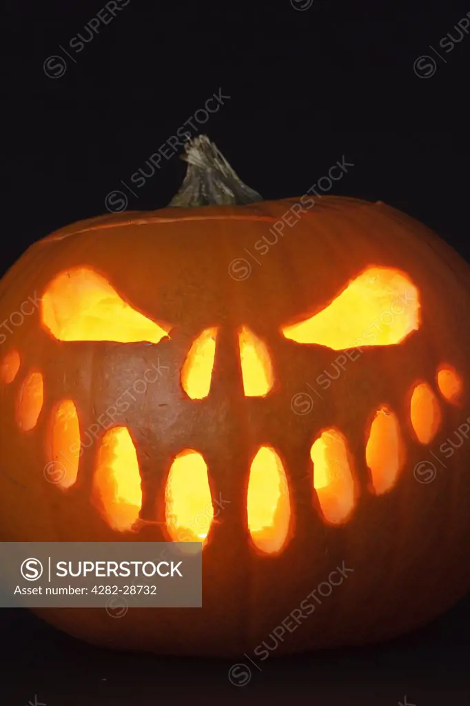 A face carved into a pumpkin for Halloween.