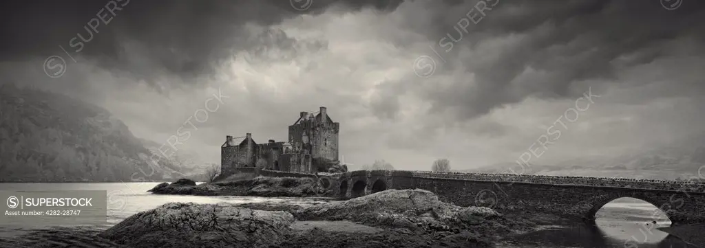 Scotland, Highland, Eilean Donan. Footbridge leading to Eilean Donan Castle situated on an island in Loch Duich.