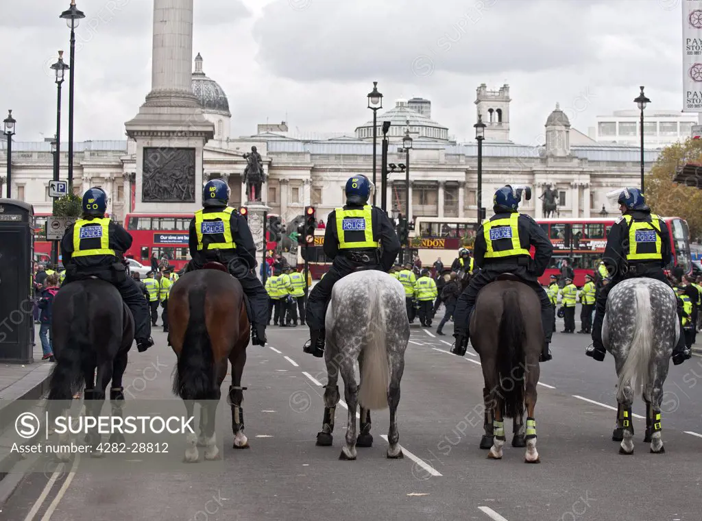 England, London, Trafalgar Square. Metropolitan mounted police on duty in central London.