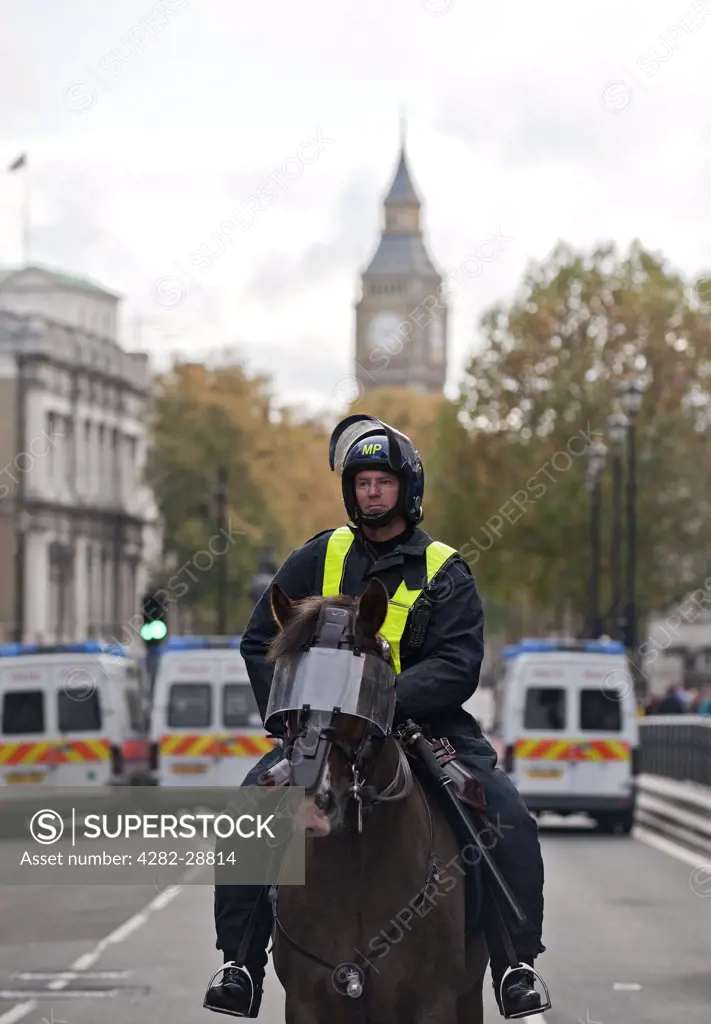 England, London, Whitehall. A mounted Metropolitan Police Officer on duty in central London.