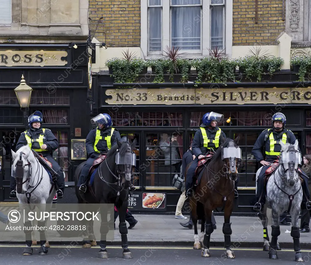 England, London, Whitehall. Mounted Metropolitan Police officers on duty in central London.