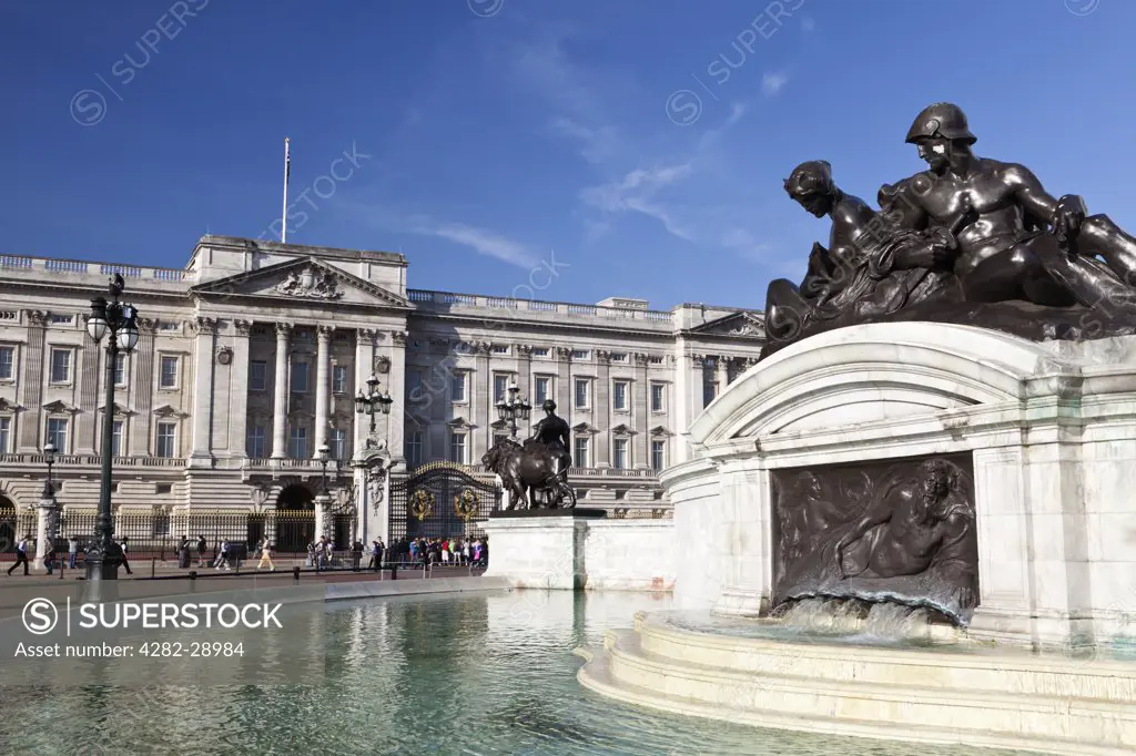 England, London, Buckingham Palace. Statues over a fountain on the Victoria Monument outside Buckingham Palace.
