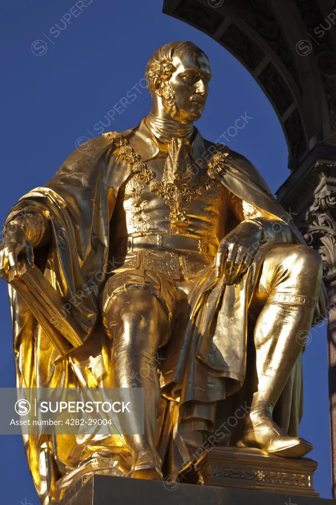 England, London, South Kensington. Statue of Prince Albert seated in the centre of the Albert Memorial. The memorial was commissioned by Queen Victoria in memory of her husband. It was designed by Sir George Gilbert Scott and opened in 1872.