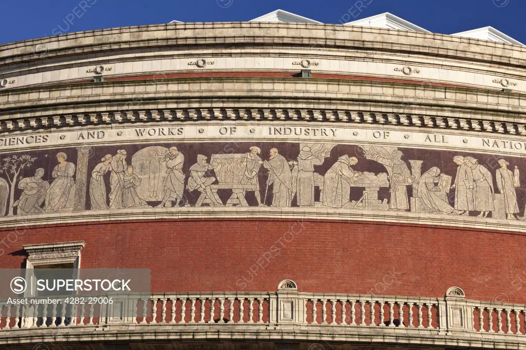 England, London, South Kensington. Exterior of the Royal Albert Hall, a concert hall opened by Queen Victoria in 1871. A mosaic frieze depicting 'The Triumph of Arts and Sciences' runs around the outside.