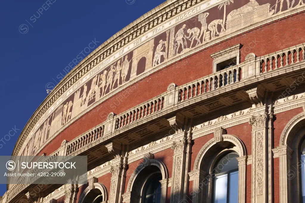 England, London, South Kensington. Exterior of the Royal Albert Hall, a concert hall opened by Queen Victoria in 1871. A mosaic frieze depicting 'The Triumph of Arts and Sciences' runs around the outside.