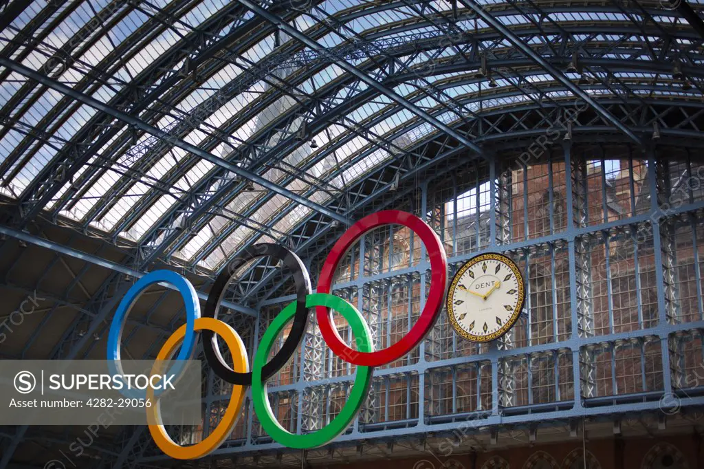 England, London, St Pancras. A giant set of Olympic rings suspended in St Pancras International Station to welcome visitors to London, host city of the 2012 Olympic Games.