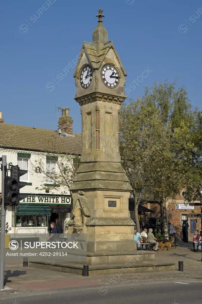 England, North Yorkshire, Thirsk. Clock Tower in Thirsk Market Place built in 1896 to commemorate the marriage of  the Duke of York, later to become King George V to Princess May of Teck, the future Queen Mary.