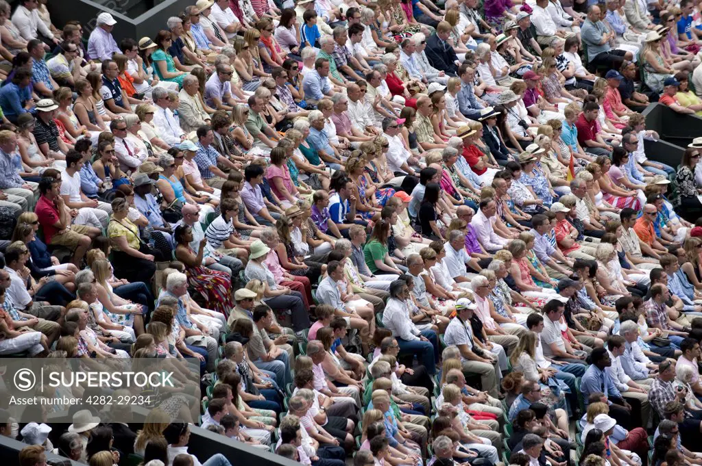 England, London, Wimbledon. Spectators on Centre Court watching the Men's Singles Final at the 2011 Wimbledon Tennis Championships.
