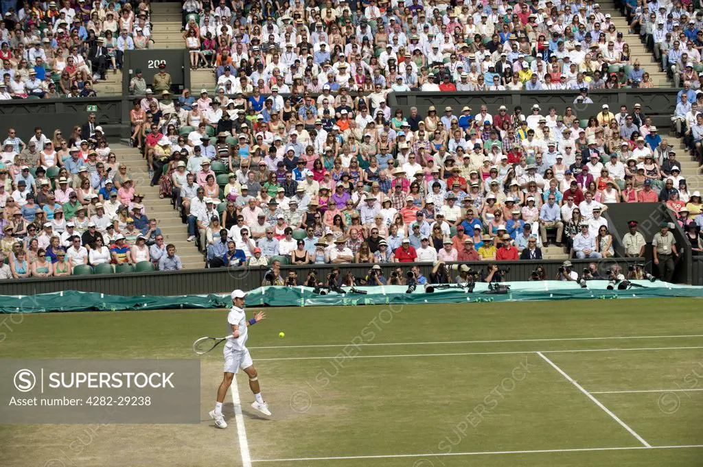 England, London, Wimbledon. Novak Djokovic playing in the Men's Singles Final on Centre Court at the 2011 Wimbledon Tennis Championships.