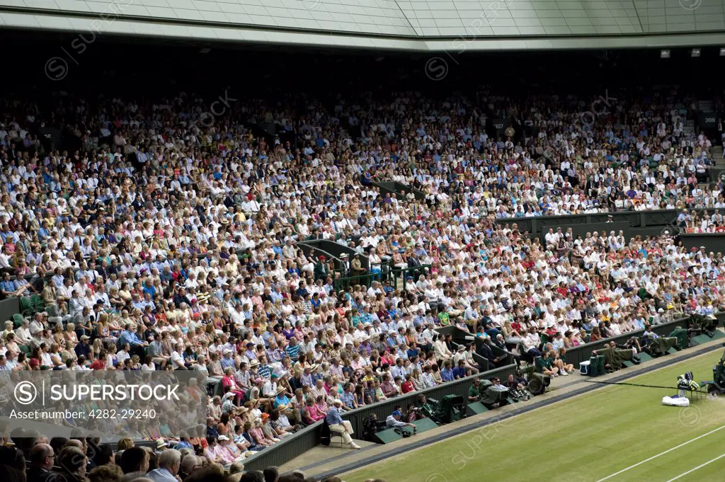 England, London, Wimbledon. Spectators on Centre Court watching the Men's Singles Final at the 2011 Wimbledon Tennis Championships.