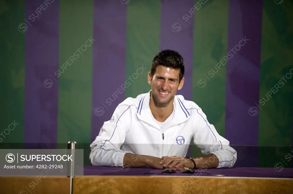 England, London, Wimbledon. Novak Djokovic (SRB) talks to the media in the champions press conference after victory at the 2011 Wimbledon Tennis Championships.